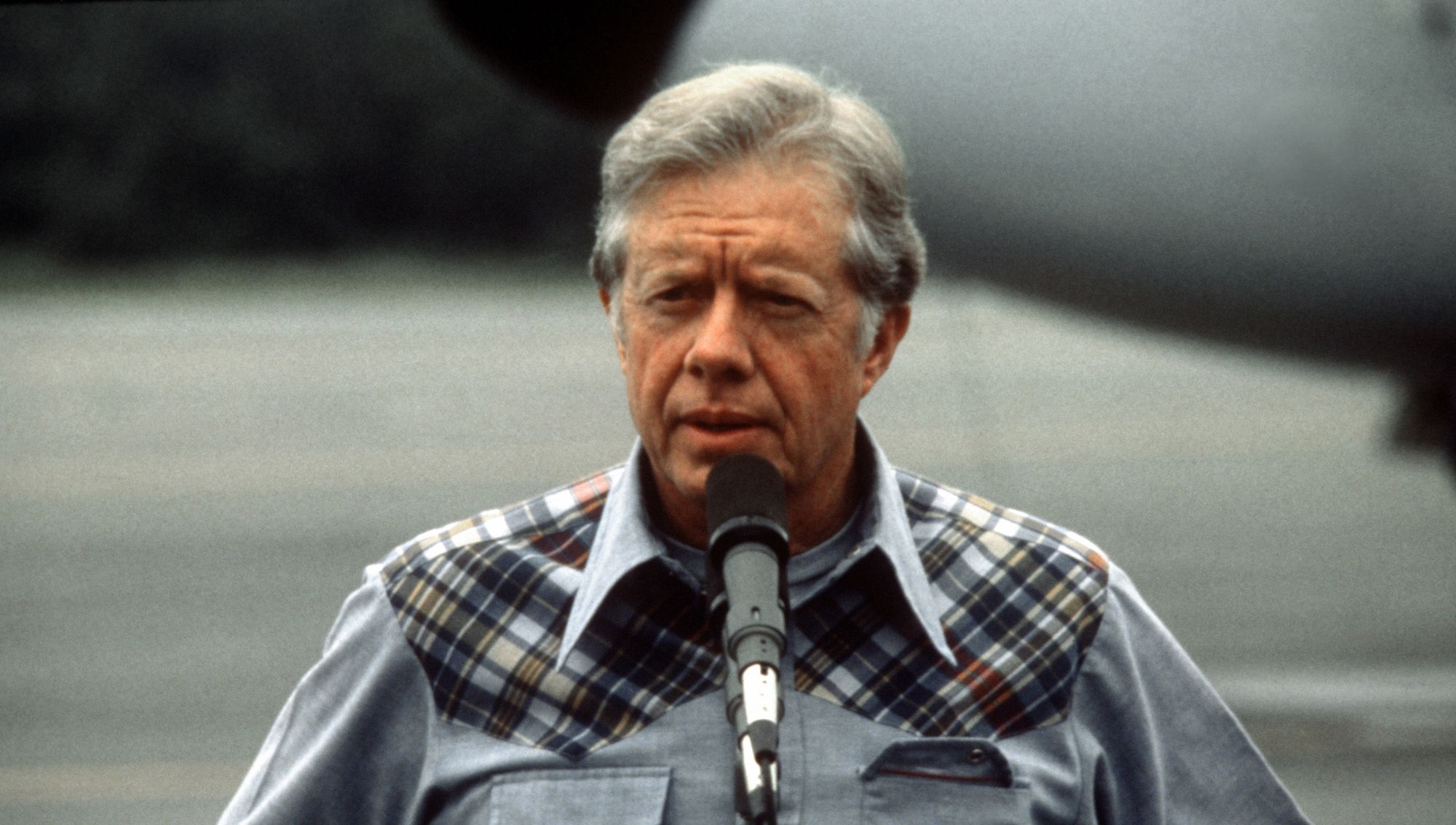 Jimmy Carter at a microphone.