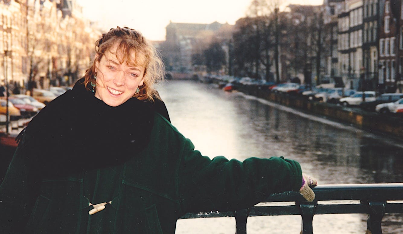 The author, pictured on a bridge in Amsterdam, in 1993, a few weeks before she was attacked.