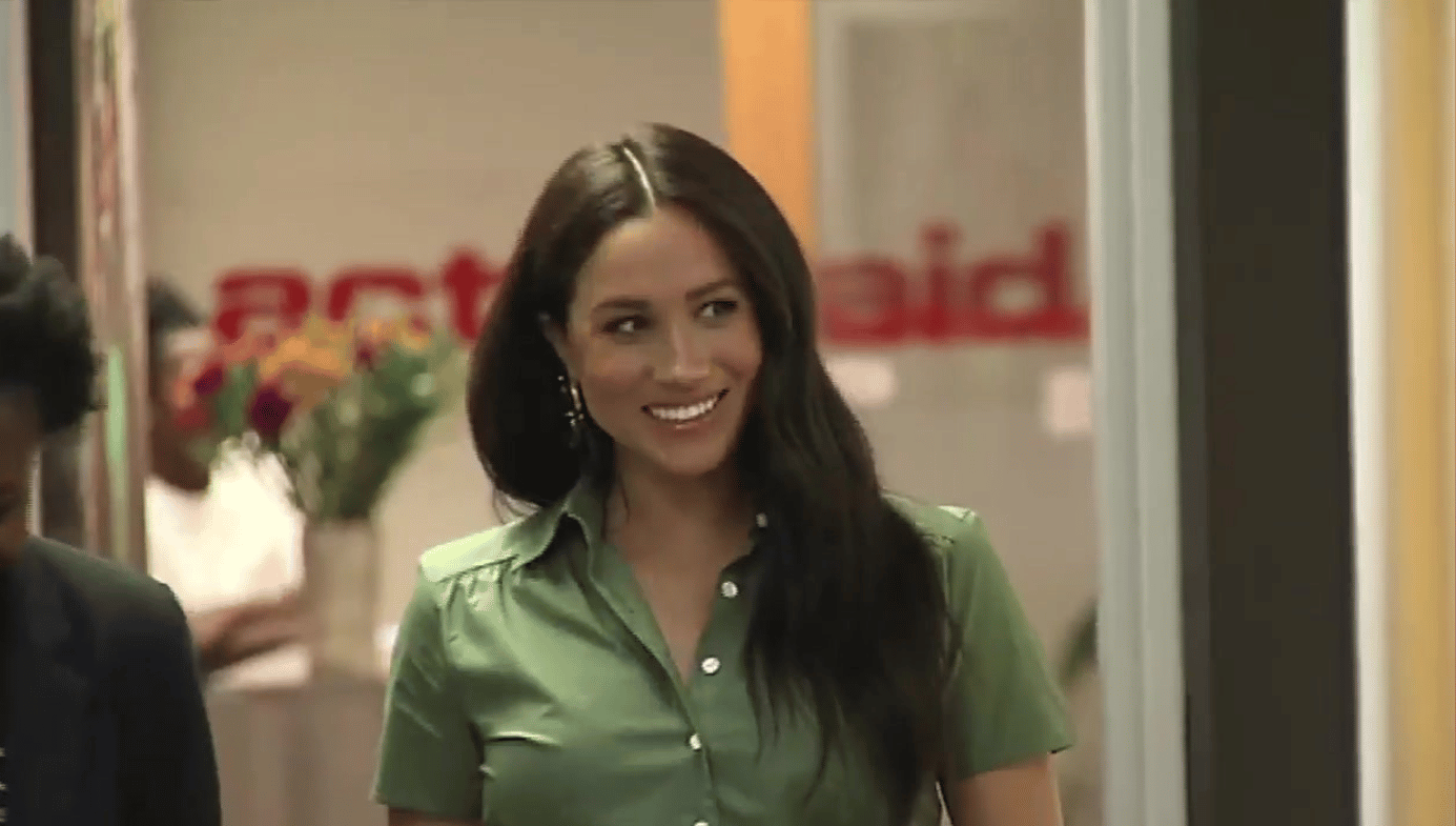 Megan Markle, Duchess of Suffolk on a visit to Action Aid in South Africa (2019). She is wearing a green shirt.