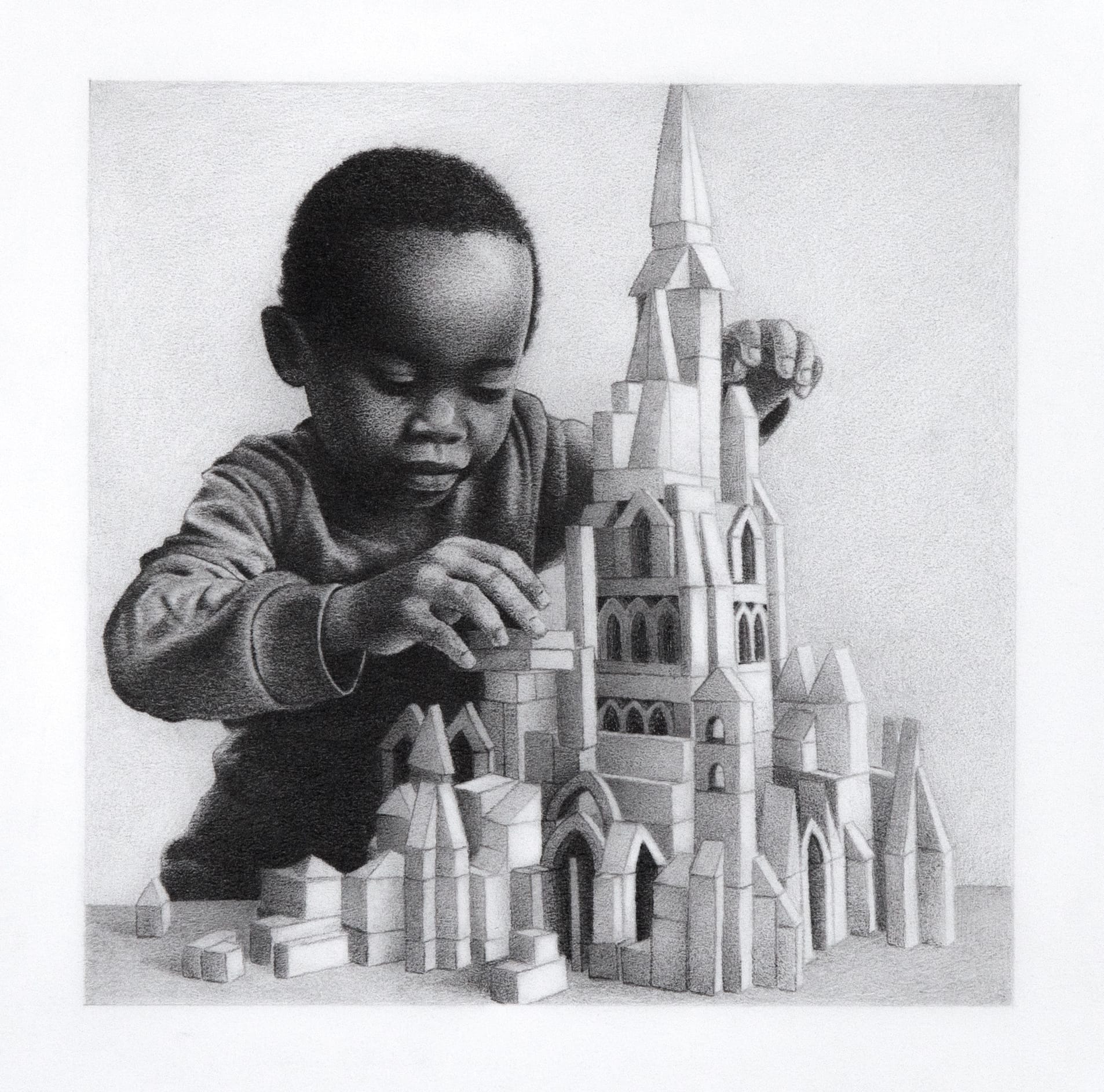 A small boy builds a cathedral out of toy bricks. 