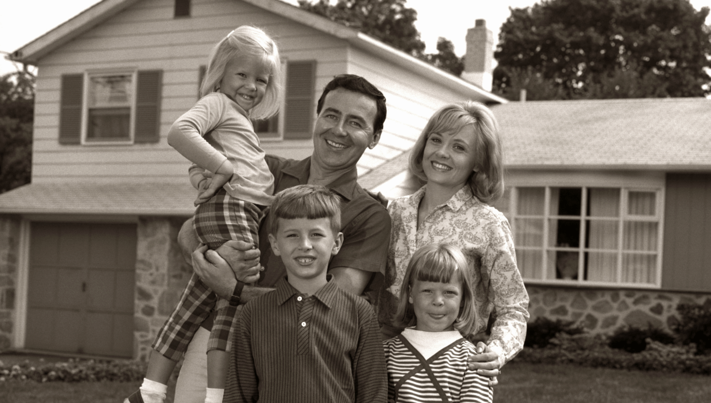 1960s FAMILY PORTRAIT OUTSIDE SUBURBAN HOUSE PARENTS 3 THREE KIDS