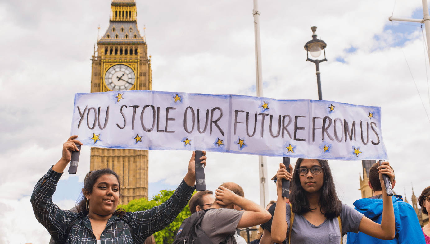 Young female pro-remain protesters carrying poster saying "You stole our future from us" as part of protests against Brexit