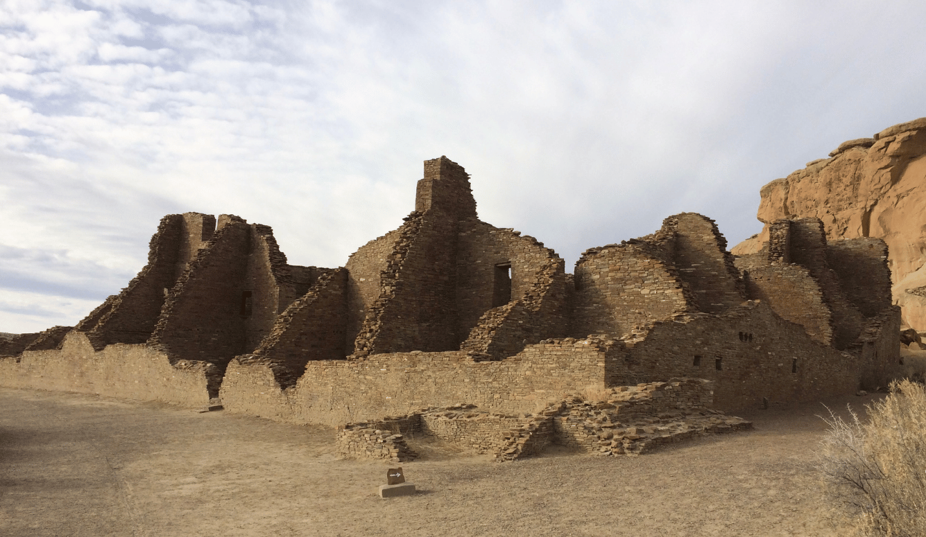 Ruins of a town amid a desert landscape. 