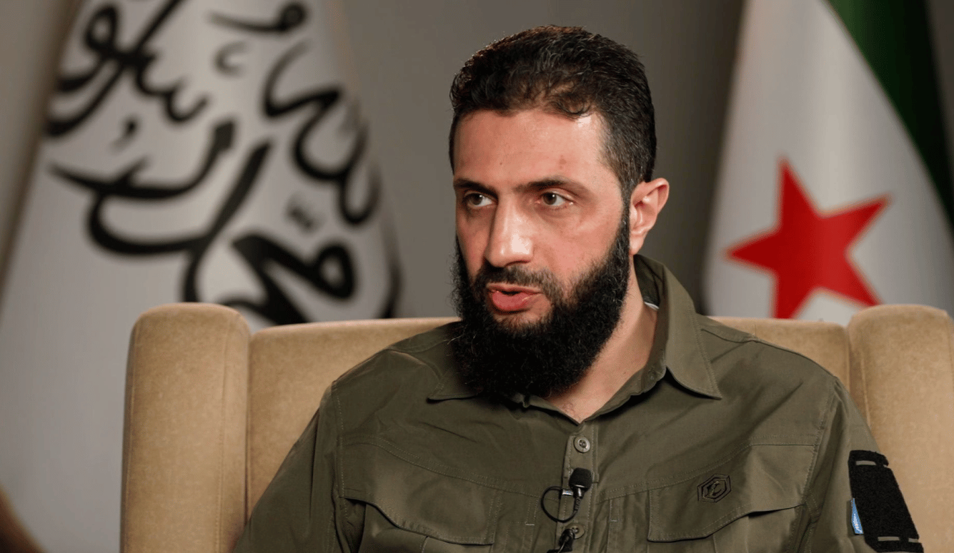 Abu Mohammad al-Jolani is a Middle Eastern man in military fatigues. 