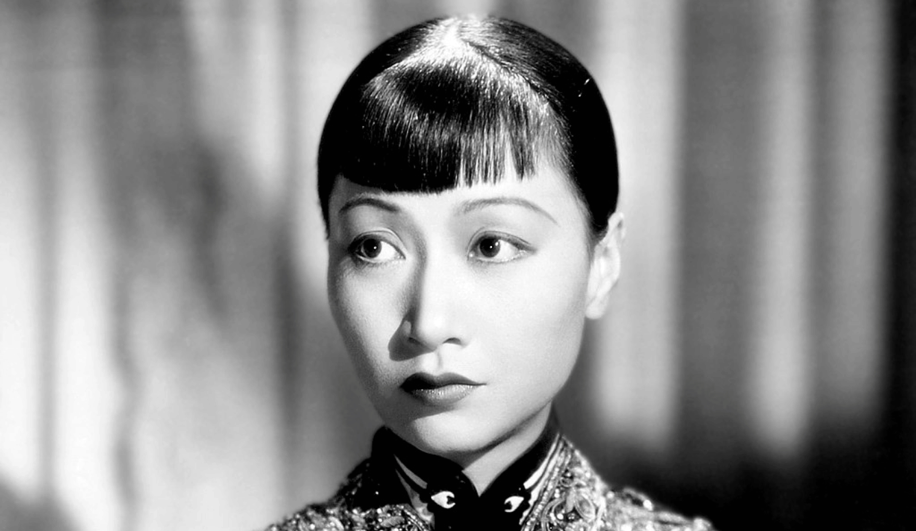 A portrait of a beautiful young Chinese actress with a fringe.