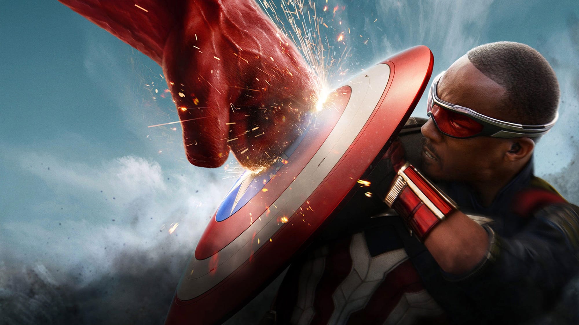 Anthony Mackie as Captain America uses his shield to block a punch from the Red Hulk played by Harrison Ford.