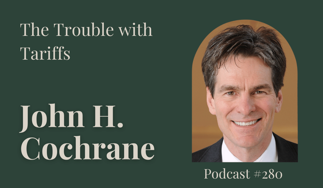 John Cochrane is a white middle-aged man, he is smiling