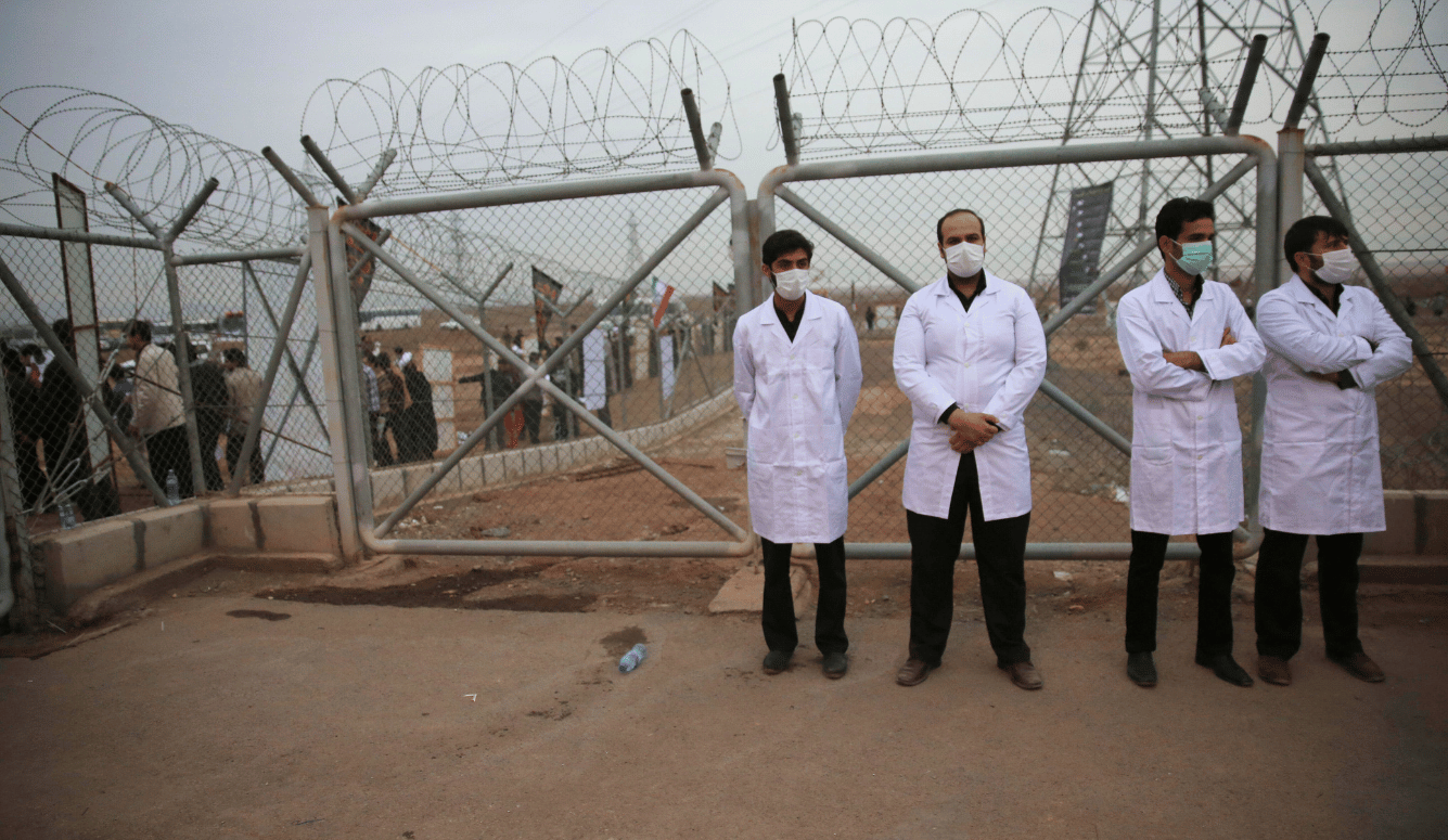A group of Iranian nuclear scientists in front of the Fordow nuclear site 