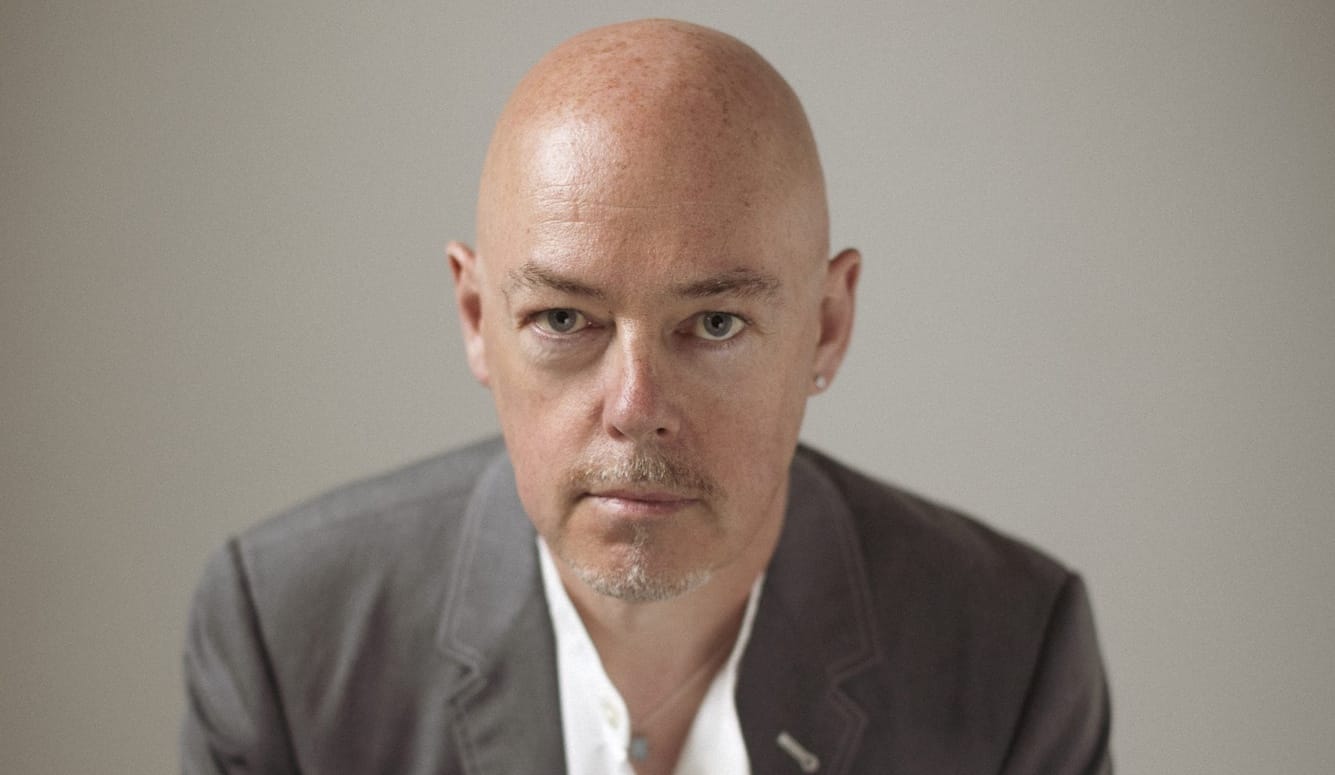 John Boyne, headshot. He is a bald, middle-aged white man with a goatie. 