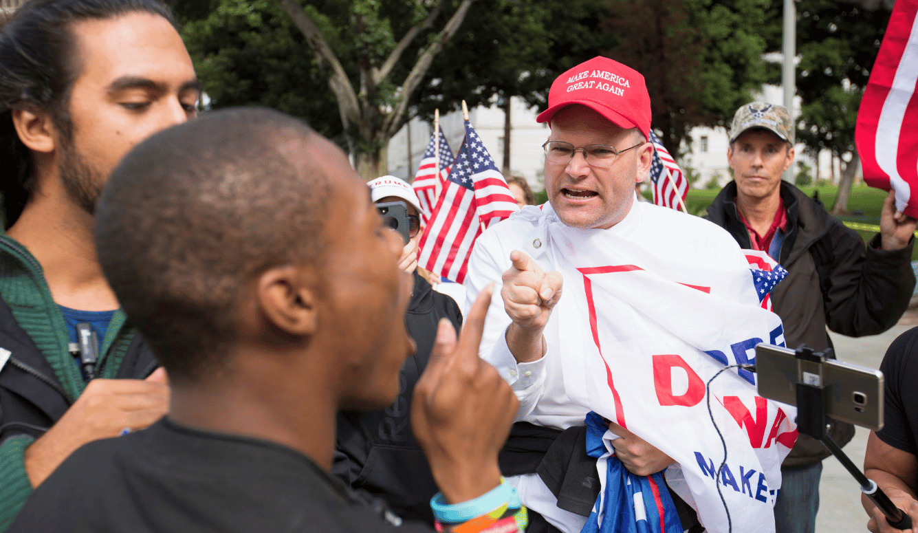 Los Angeles, California, January 18, 2017 — A heated exchange during an immigration protest. Shutterstock.