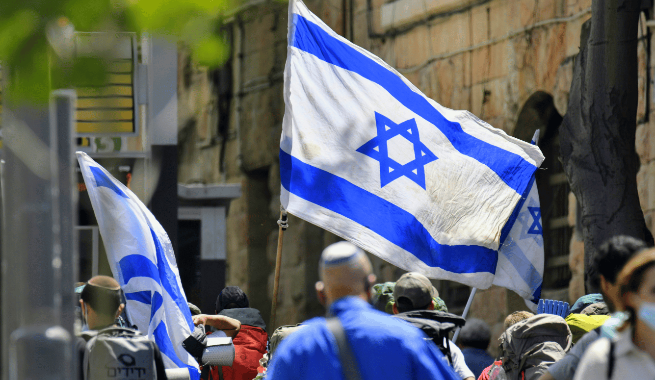 Israelis carrying Israeli flags. 