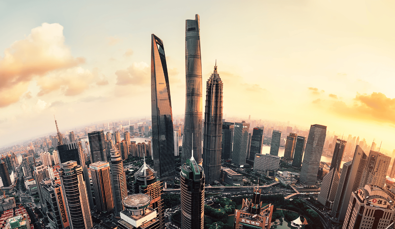 Shanghai Lujiazui global financial district at sunset with golden sunshine.