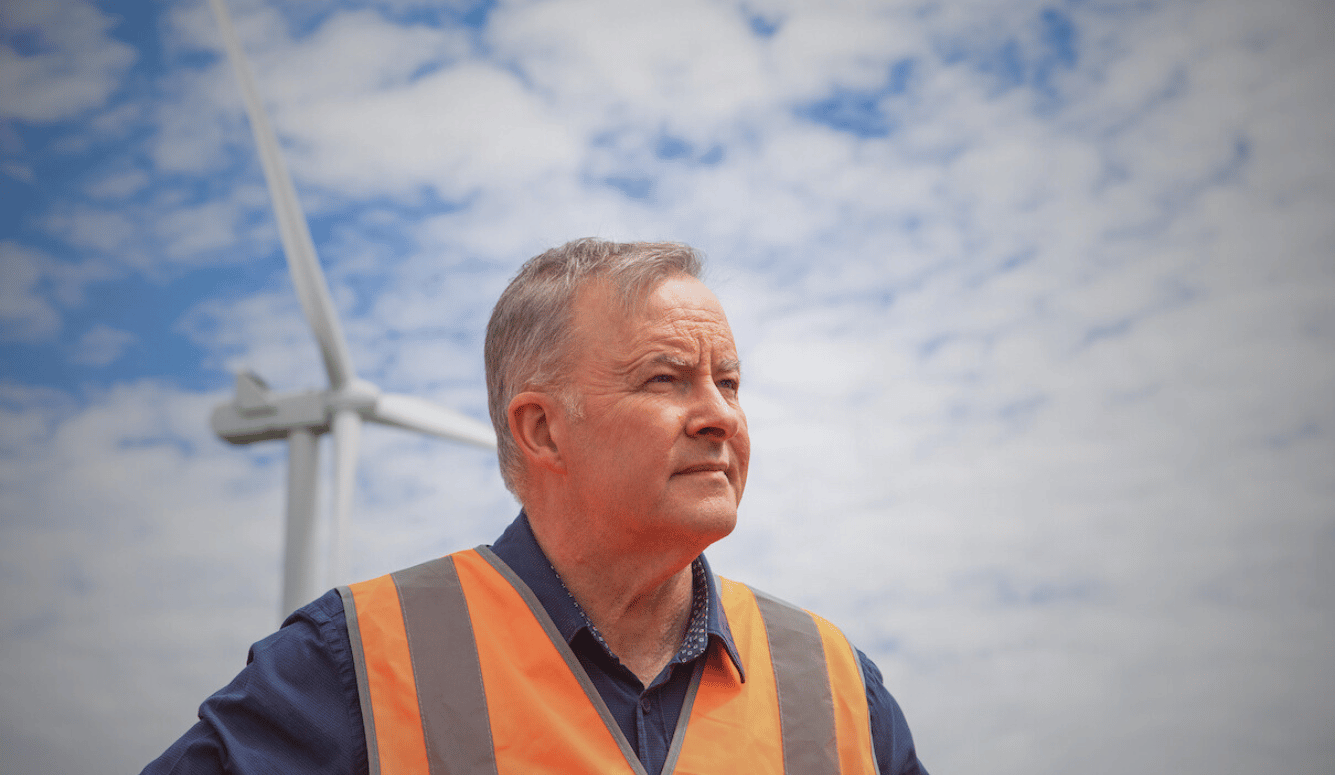Australian prime minister Anthony Albanese visiting a wind farm in New South Wales. He wears orange hi-vis. 