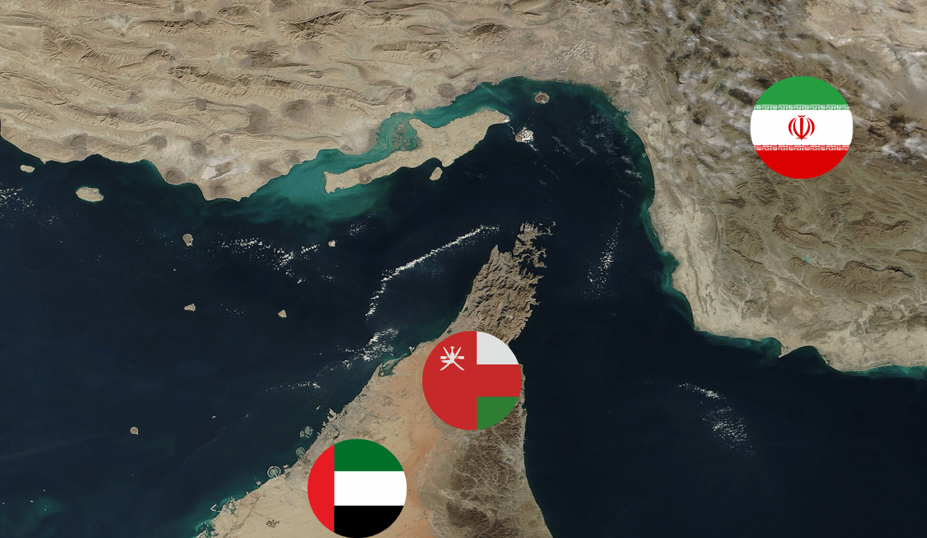 Satellite view of the Musandam Peninsula’s rugged limestone mountains jutting into the Strait of Hormuz.Images of flags for Iran, Oman and the UAE.