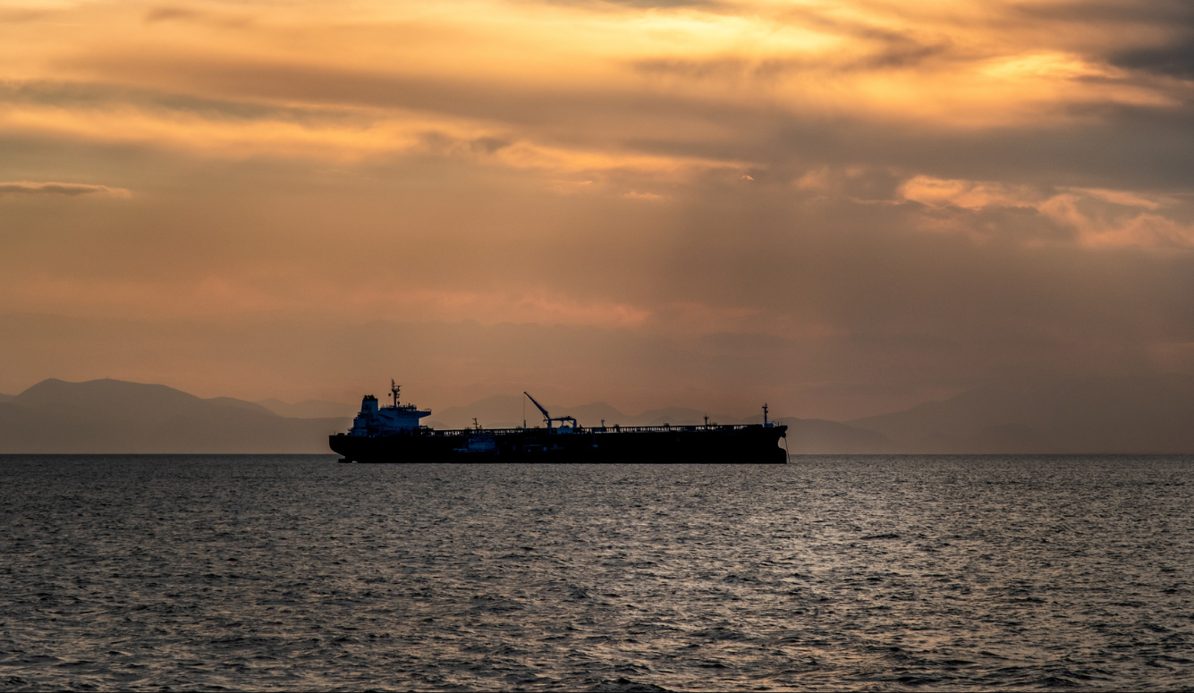 Oil tanker at sunset. 