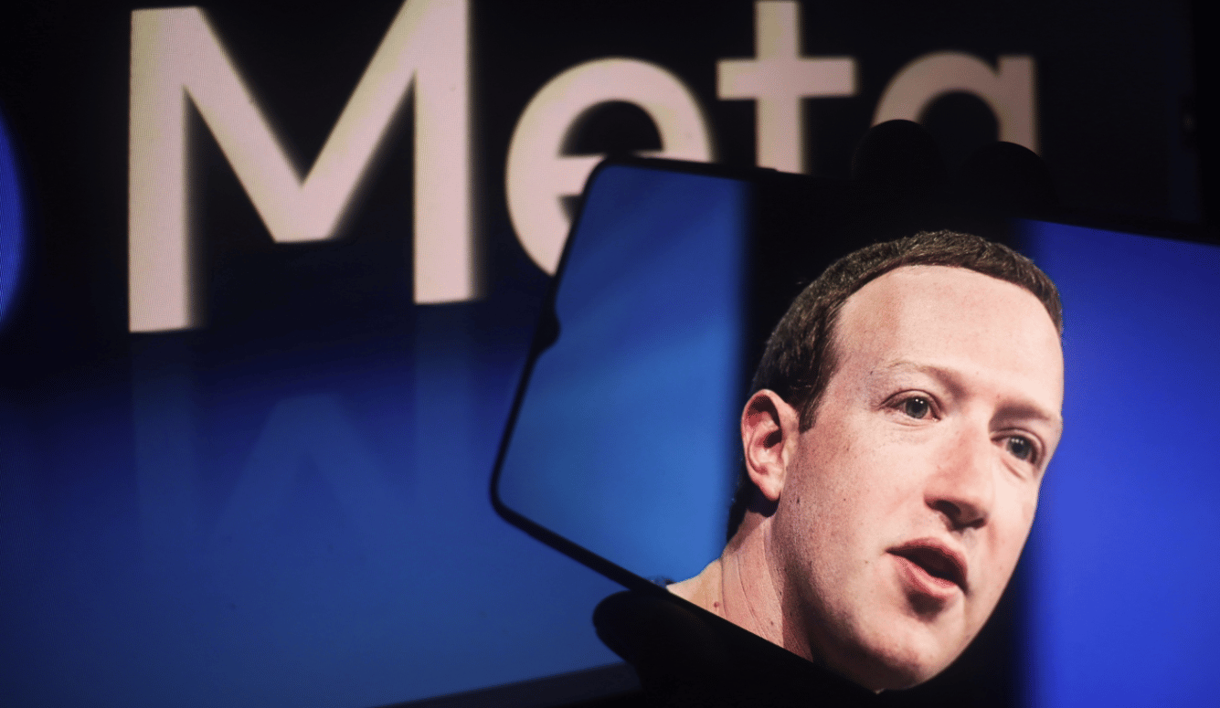 Mark Zuckerberg image on mobile screen and Meta AI in laptop background, Mark Zuckerberg is the co-founder and CEO of Meta Platforms, Inc., the company behind Facebook. 