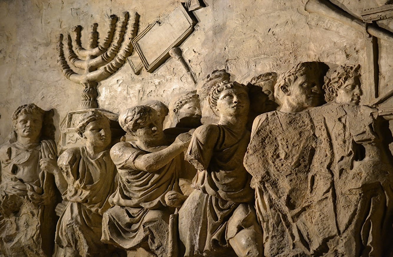Roman soldiers carry the Temple menorah and sacred objects in a triumphal procession. Relief panel from the Arch of Titus, Rome, c. 81 CE.