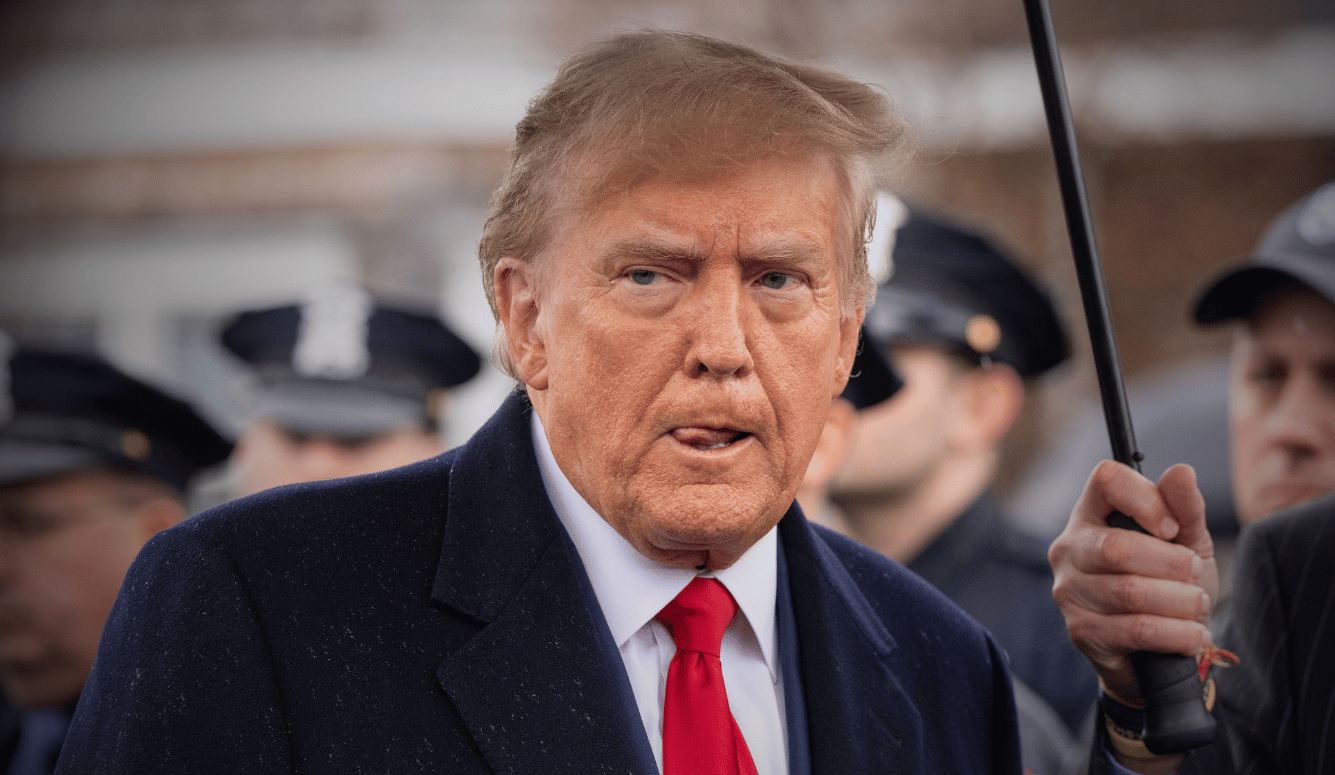 Trump looking unsur, in suit.
