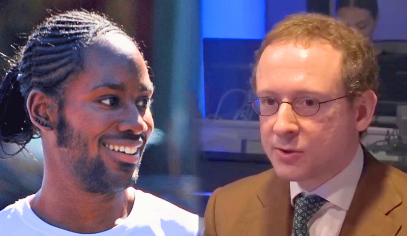 Left, Arday, a black man smiles. He has braided hair and beard. Cofnas is a white man with glasses and reddish hair. He wears a suit.