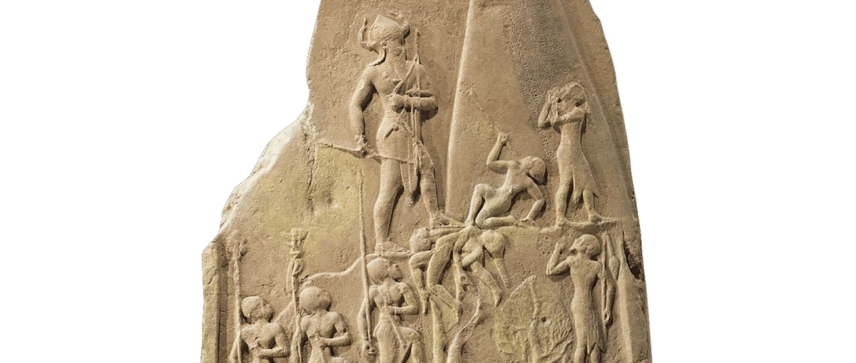 Ancient stone victory stele showing King Naram-Sin standing above defeated enemies beneath carved inscriptions.